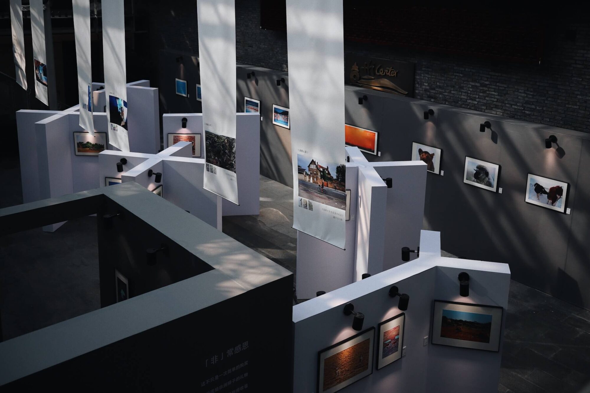 Gallery exhibition with framed photos.