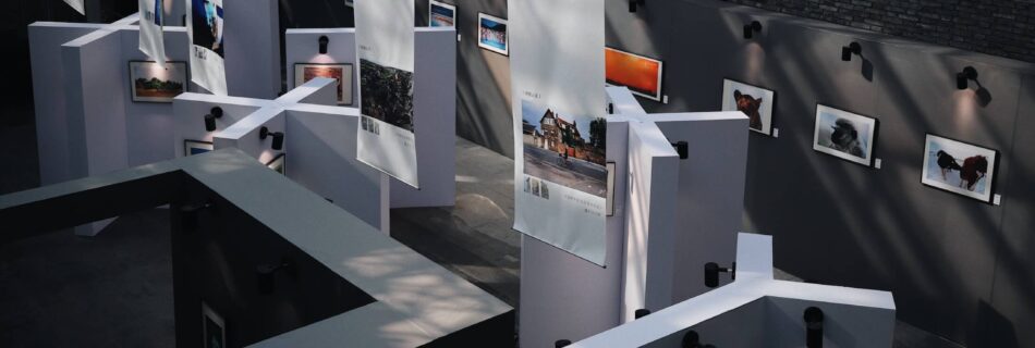 Gallery exhibition with framed photos.