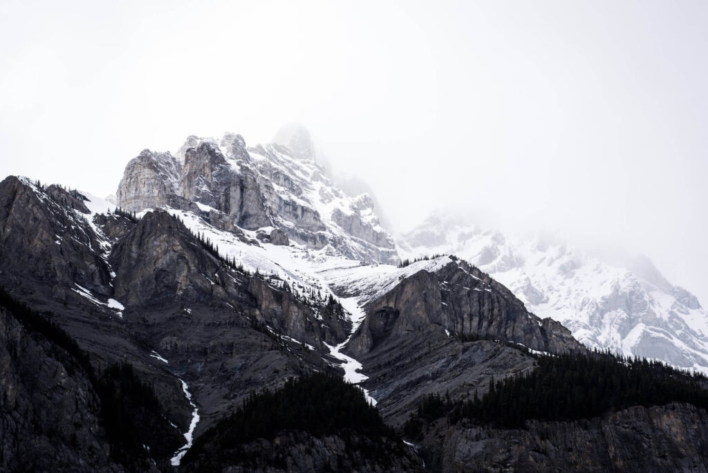 Snow-capped mountain range in the clouds.