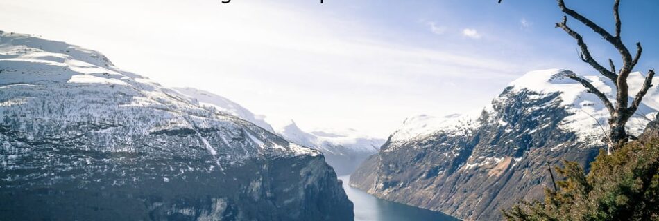 Snowy mountains and fjord in Norway.