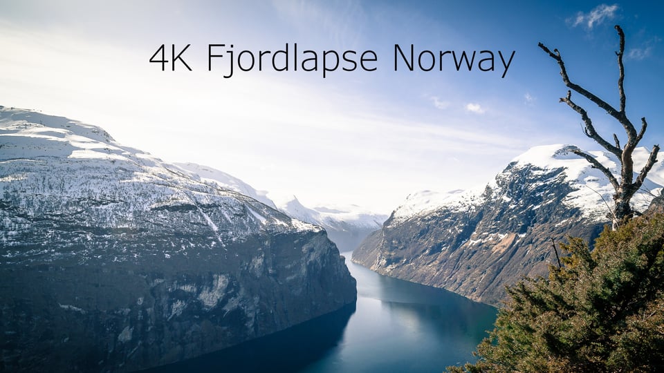 Snowy mountains and fjord in Norway.