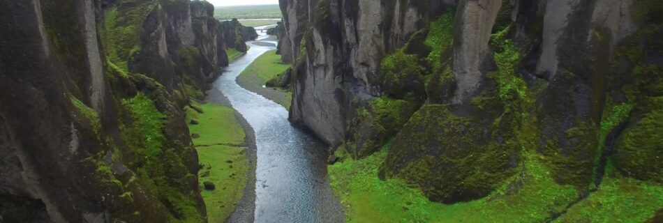 Aerial view of a river flowing through a canyon.