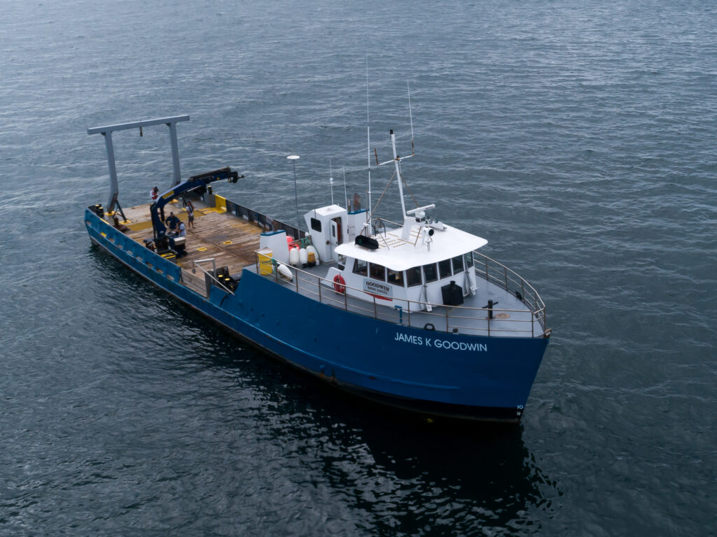 A big size blue and white color ship in the water